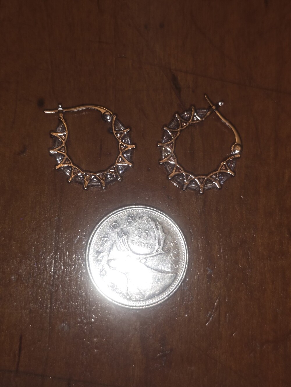 New Gold Toned Huggie Hoop Earrings With Zirconias Set In Prongs.
